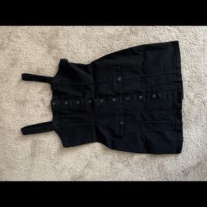 A black buttoned jumper dress